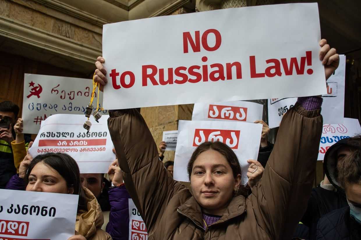 A protester holding a sign against Georgian Dream's first attempt to pass foreign agents law in March 2023. Photo: Mariam Nikuradze/OC Media.