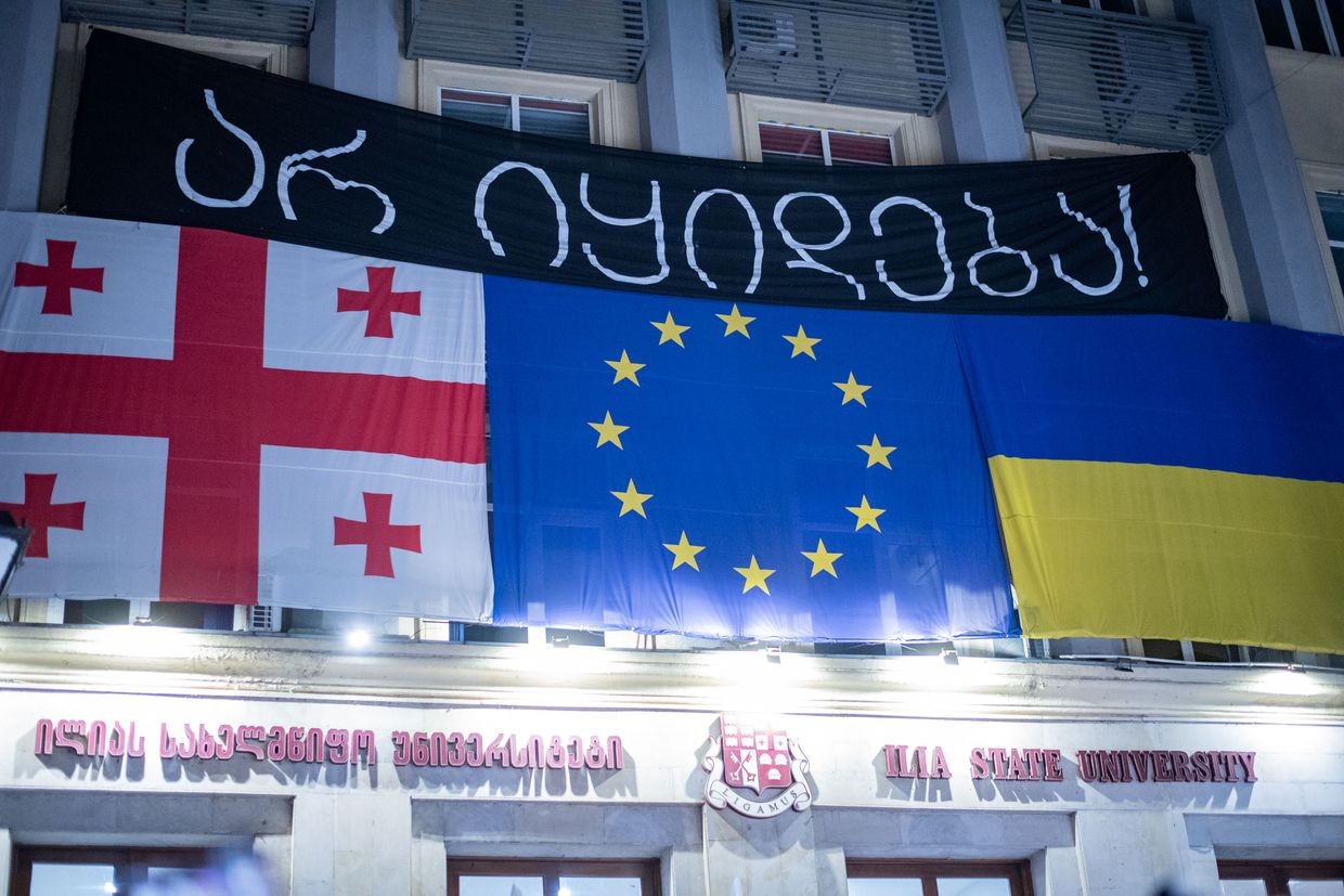 A banner above the main entrance to Ilia State University reads ‘Not for sale’. Photo: Mariam Nikuradze/OC Media.
