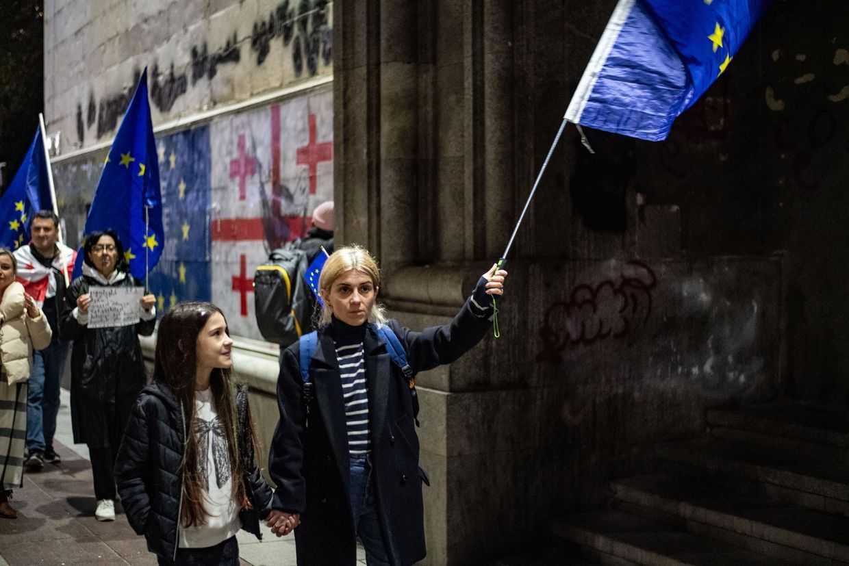 Ana Bdeiani protesting with her daughter in November 2025. Photo: Mariam Nikuradze/OC Media.